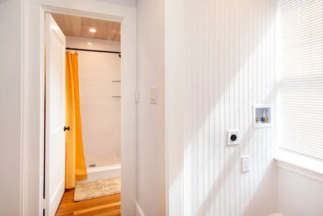 a view of a bathroom from a hallway