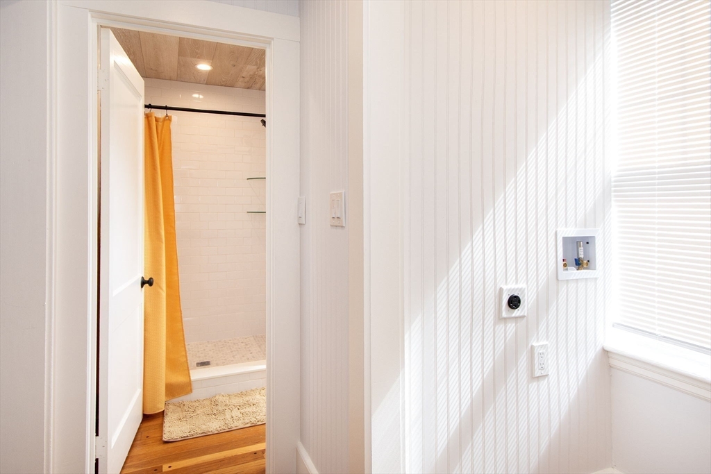 90 Shore Avenue Quincy, MA 02169 - Photo 20 of 38 a view of a bathroom from a hallway