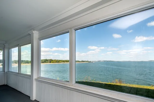 a view of an empty room and glass door