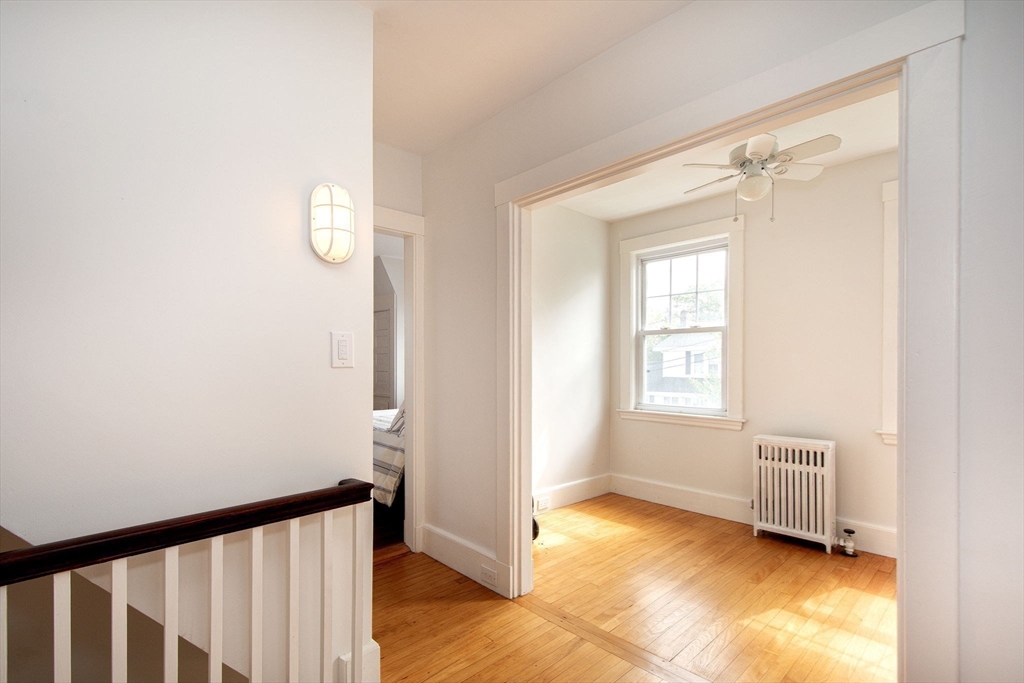 90 Shore Avenue Quincy, MA 02169 - Photo 25 of 38 a view of empty room with wooden floor and fan