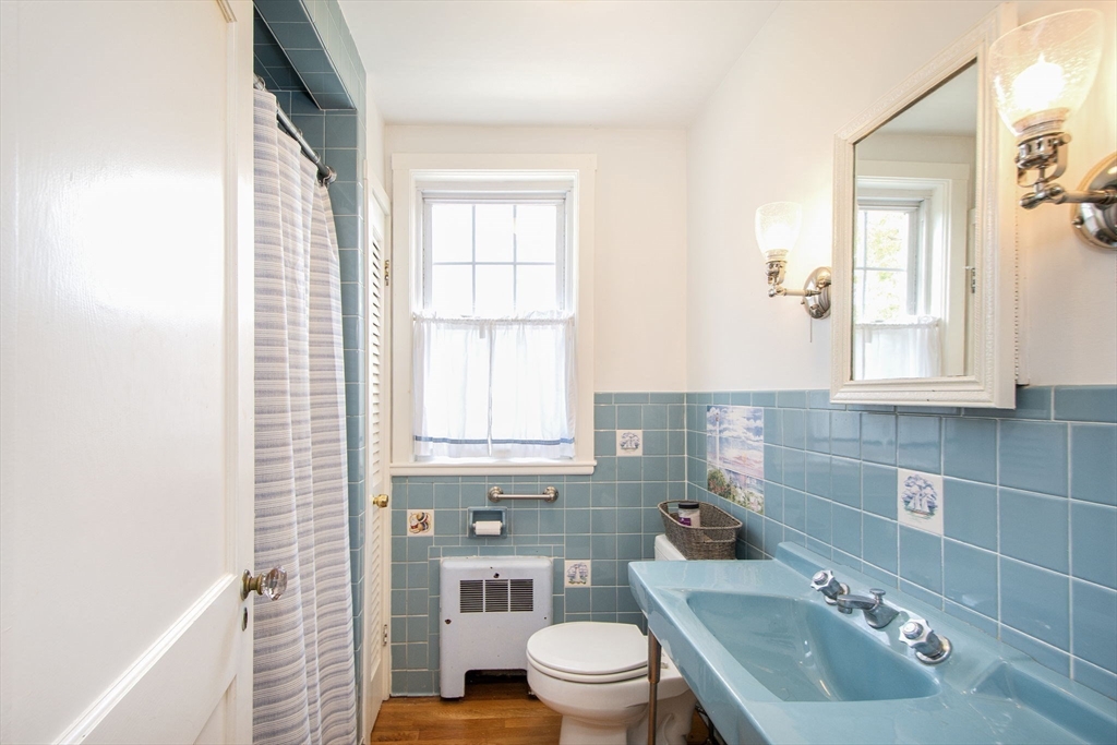 90 Shore Avenue Quincy, MA 02169 - Photo 26 of 38 a bathroom with a sink toilet and shower