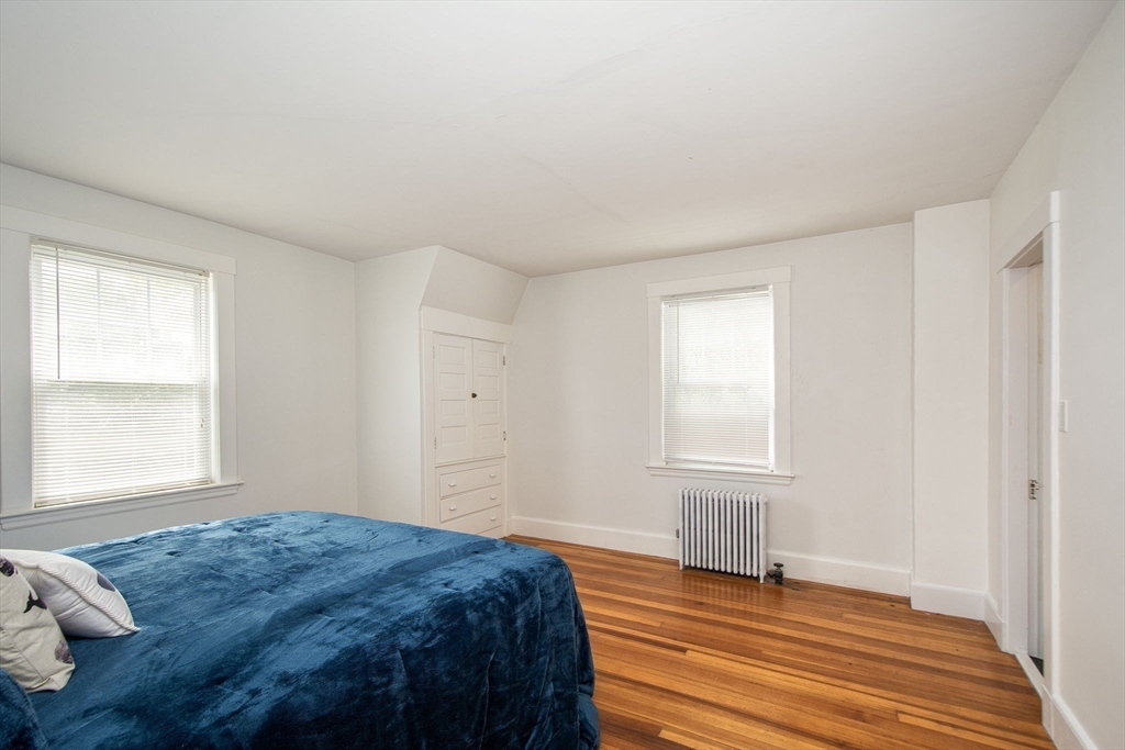 90 Shore Avenue Quincy, MA 02169 - Photo 34 of 38 a bedroom with a bed and a window
