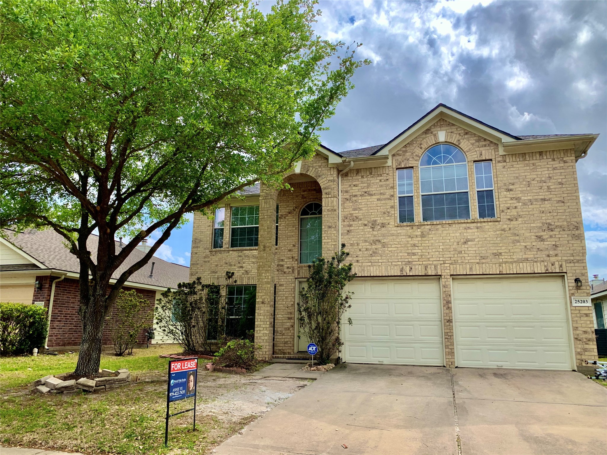 a front view of a house with garage