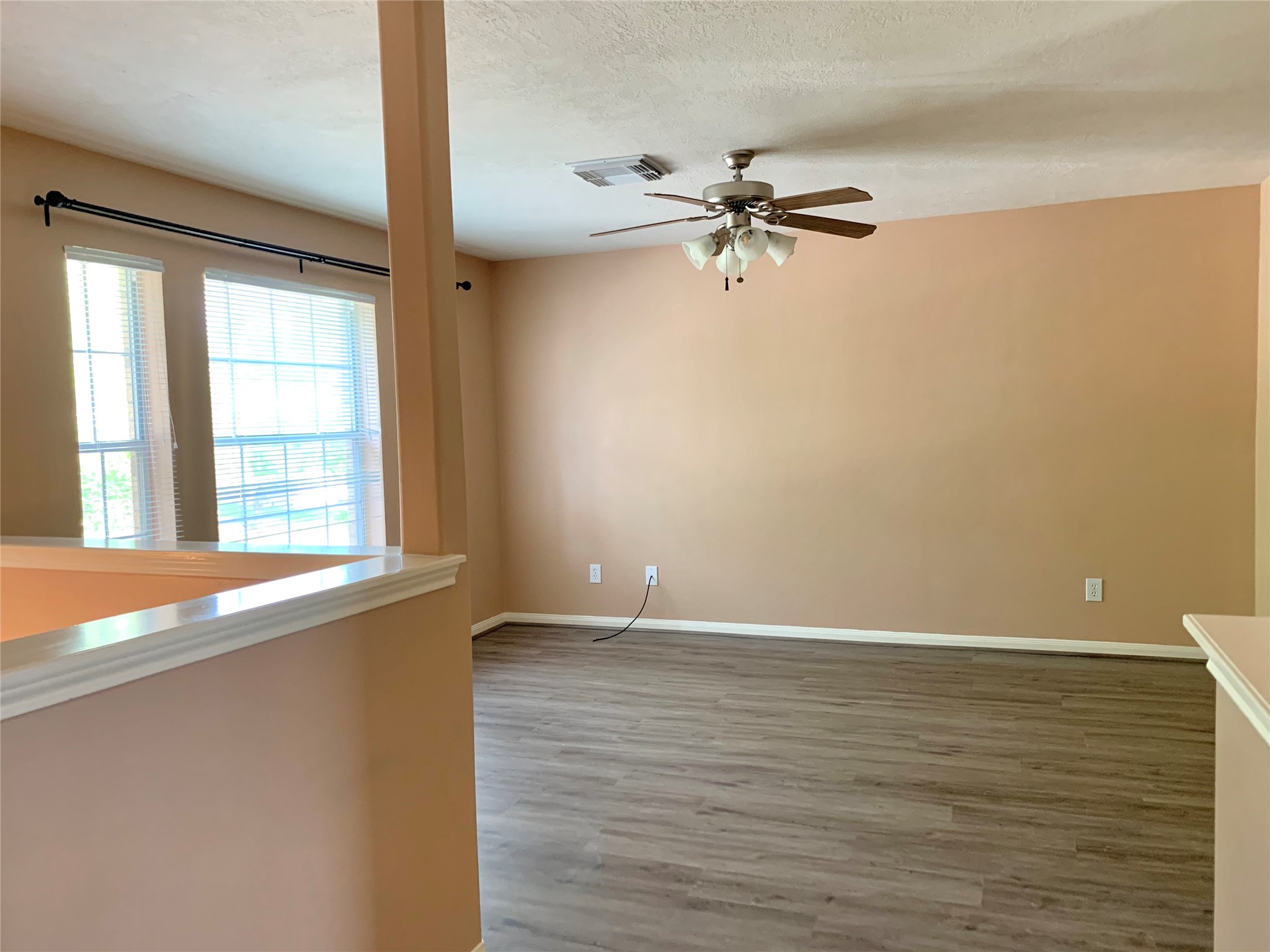 25203 Bluma Ranch Drive Katy, TX 77494 - Photo 13 of 26 wooden floor in an empty room with a window
