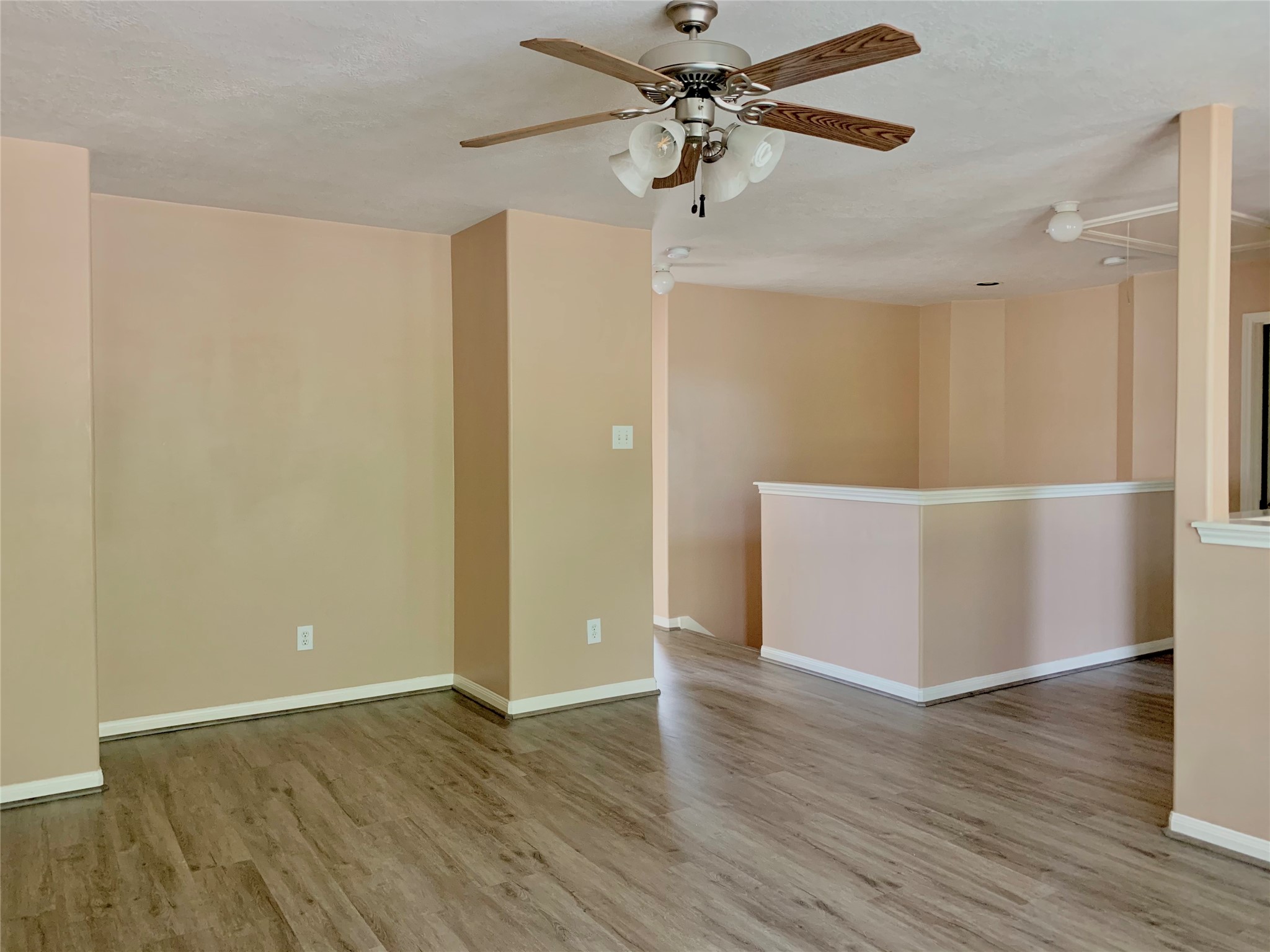 25203 Bluma Ranch Drive Katy, TX 77494 - Photo 14 of 26 an empty room with wooden floor closet and fan