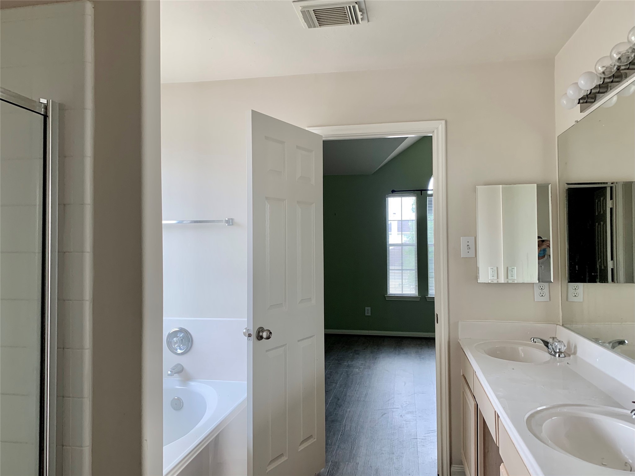 25203 Bluma Ranch Drive Katy, TX 77494 - Photo 20 of 26 a en suite bathroom with a sink and a mirror