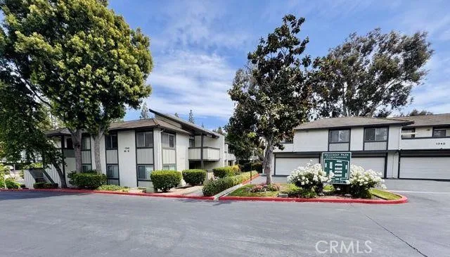 a view of a house with a yard and a garden