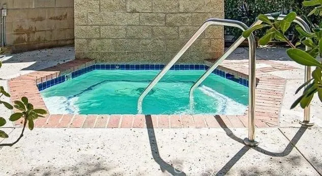 a view of a wooden floor and a bench in the patio