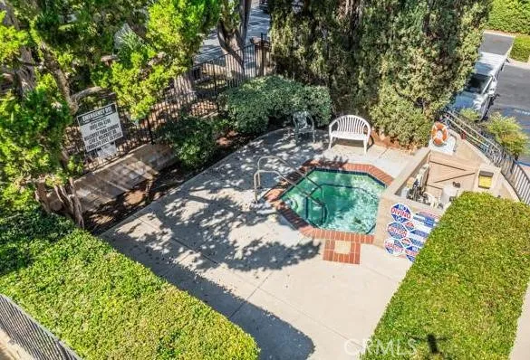an aerial view of a house with a yard and garden