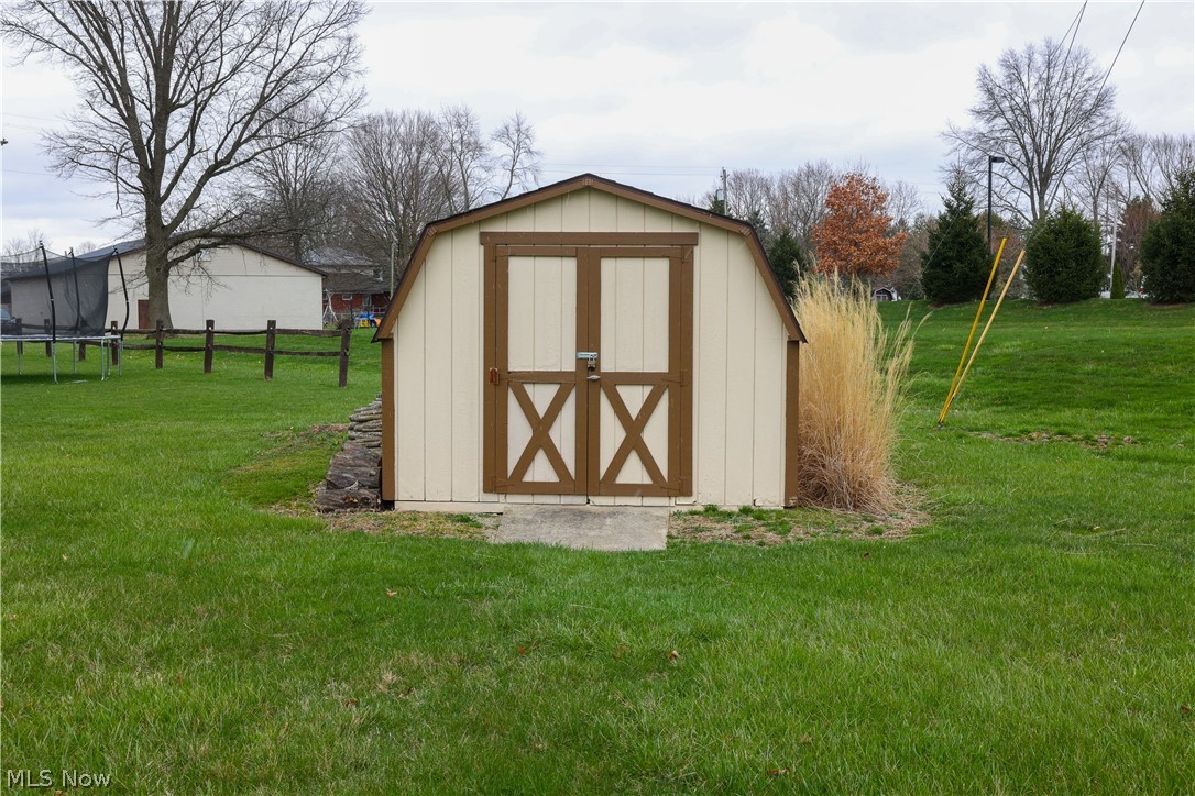 4993 Emalene Road Wooster, OH 44691 - Photo 30 of 30 View of shed / structure with a trampoline and a yard