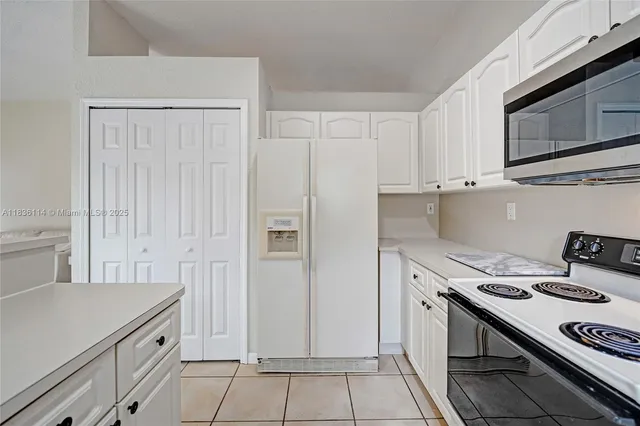 a kitchen with a stove and a microwave