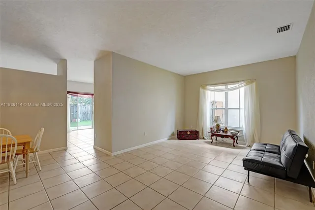 a view of a livingroom with furniture and windows