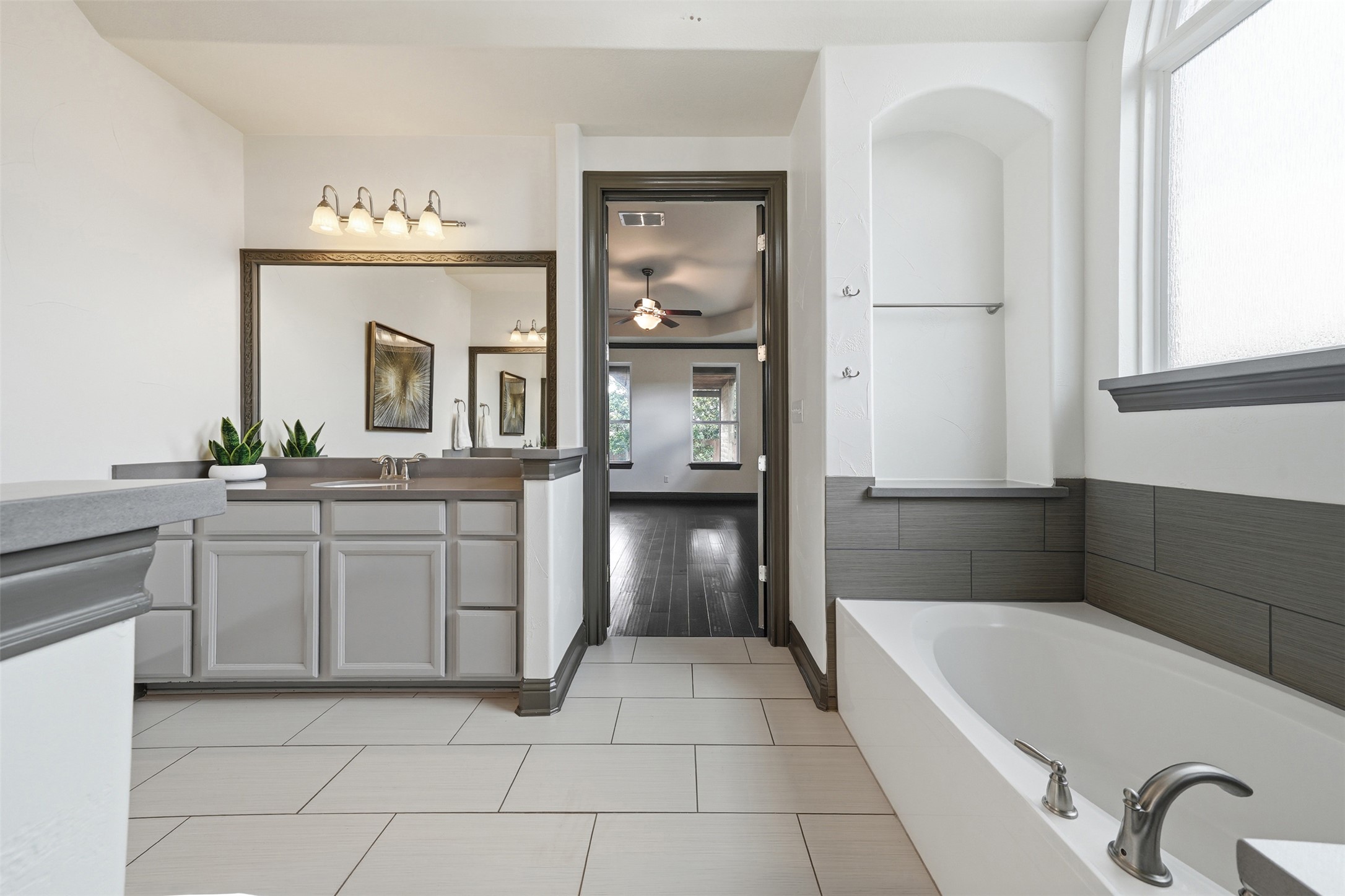 8729 Vantage Point Drive Austin, TX 78737 - Photo 19 of 33 A pristine bath space offers a relaxing soaking tub and dual vanities for daily routines.