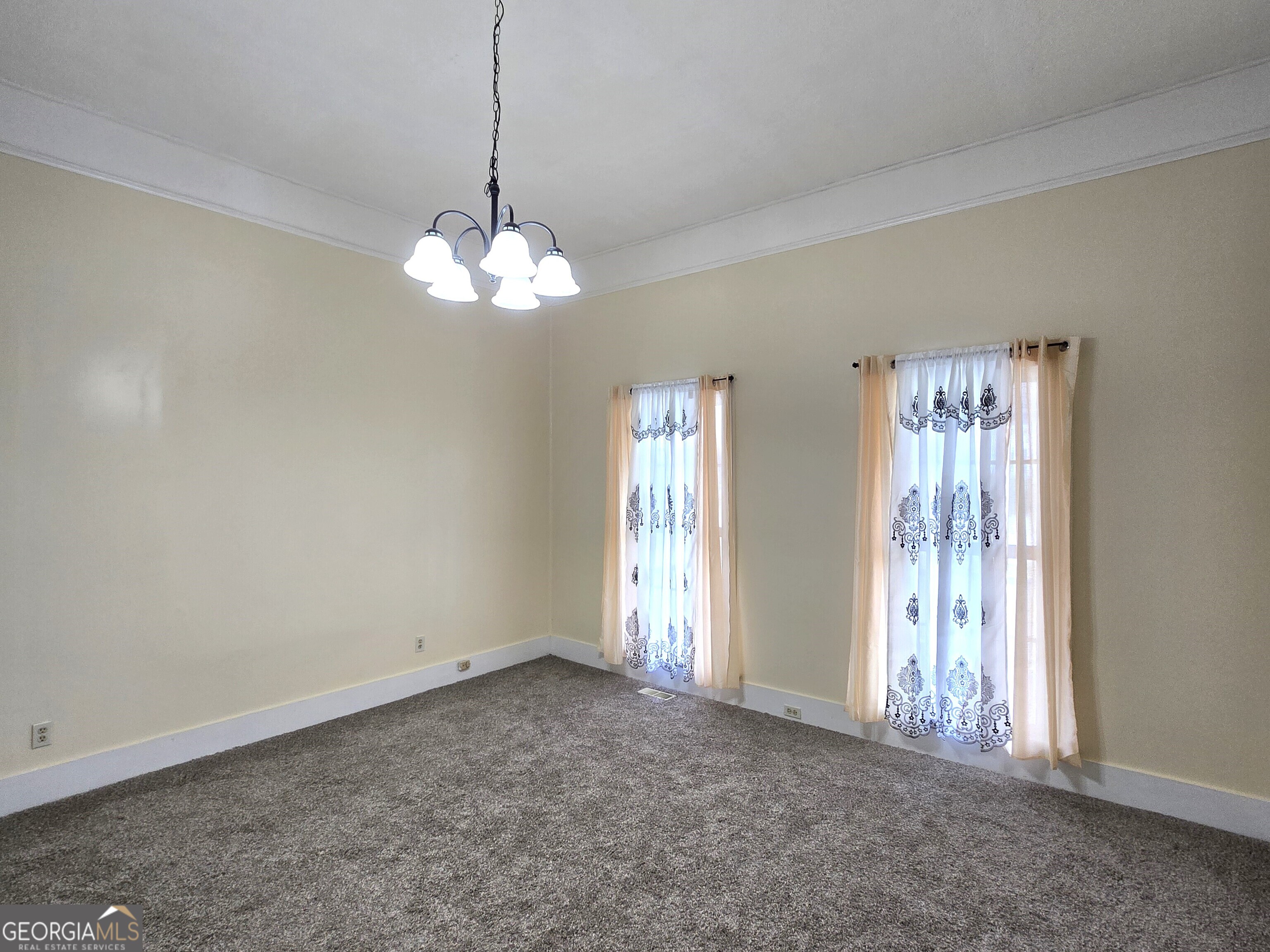 35 Cheatham Street Wadley, GA 30477 - Photo 12 of 18 a view of a chandelier in big room and chandelier