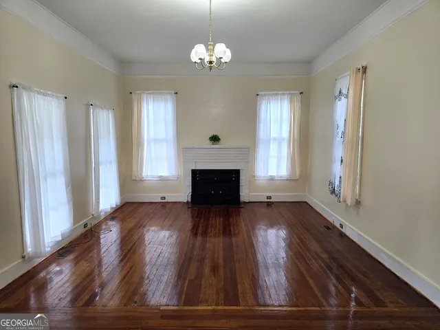 wooden floor in an empty room with windows