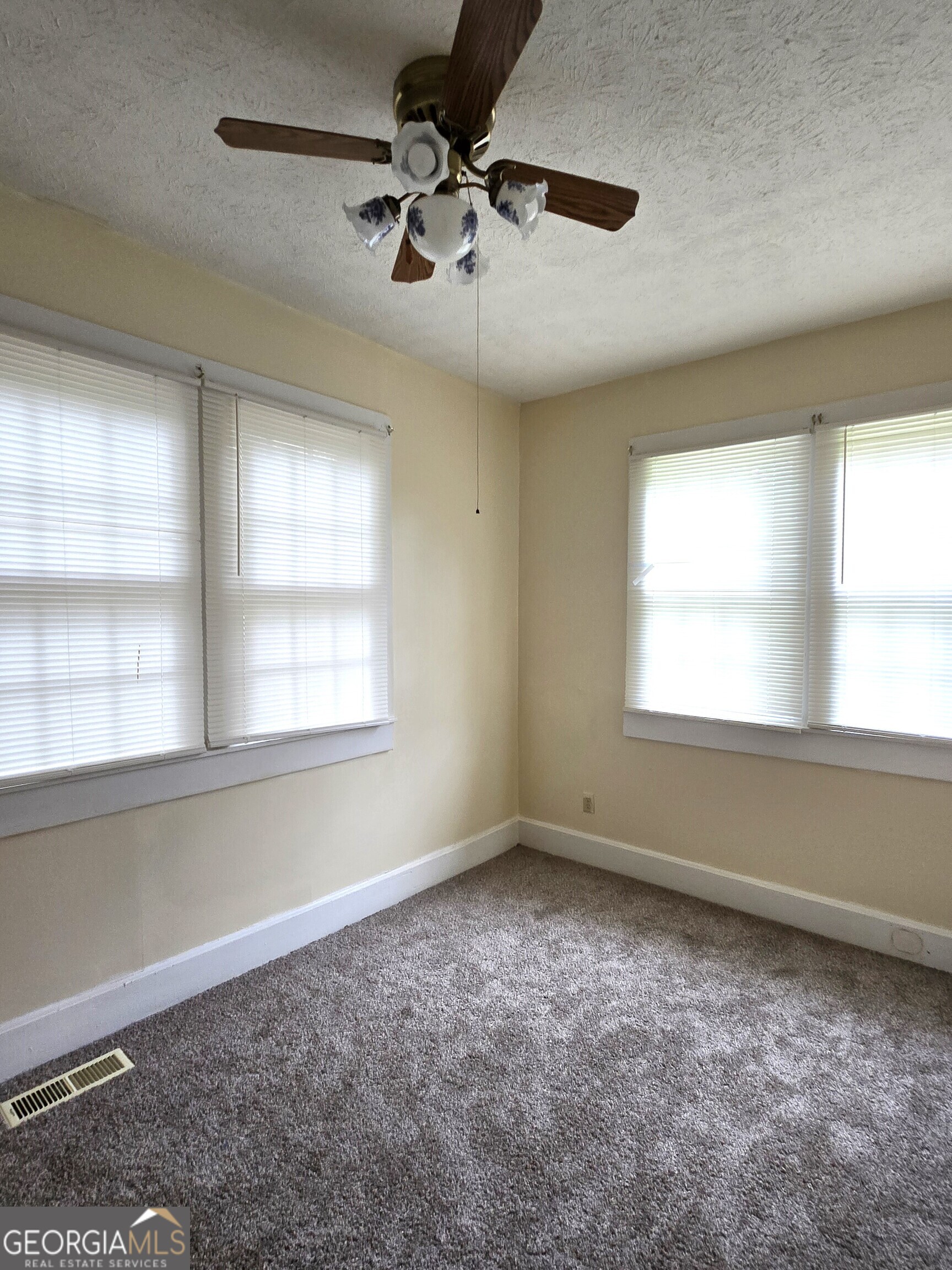35 Cheatham Street Wadley, GA 30477 - Photo 18 of 18 a view of room with a ceiling fan and window