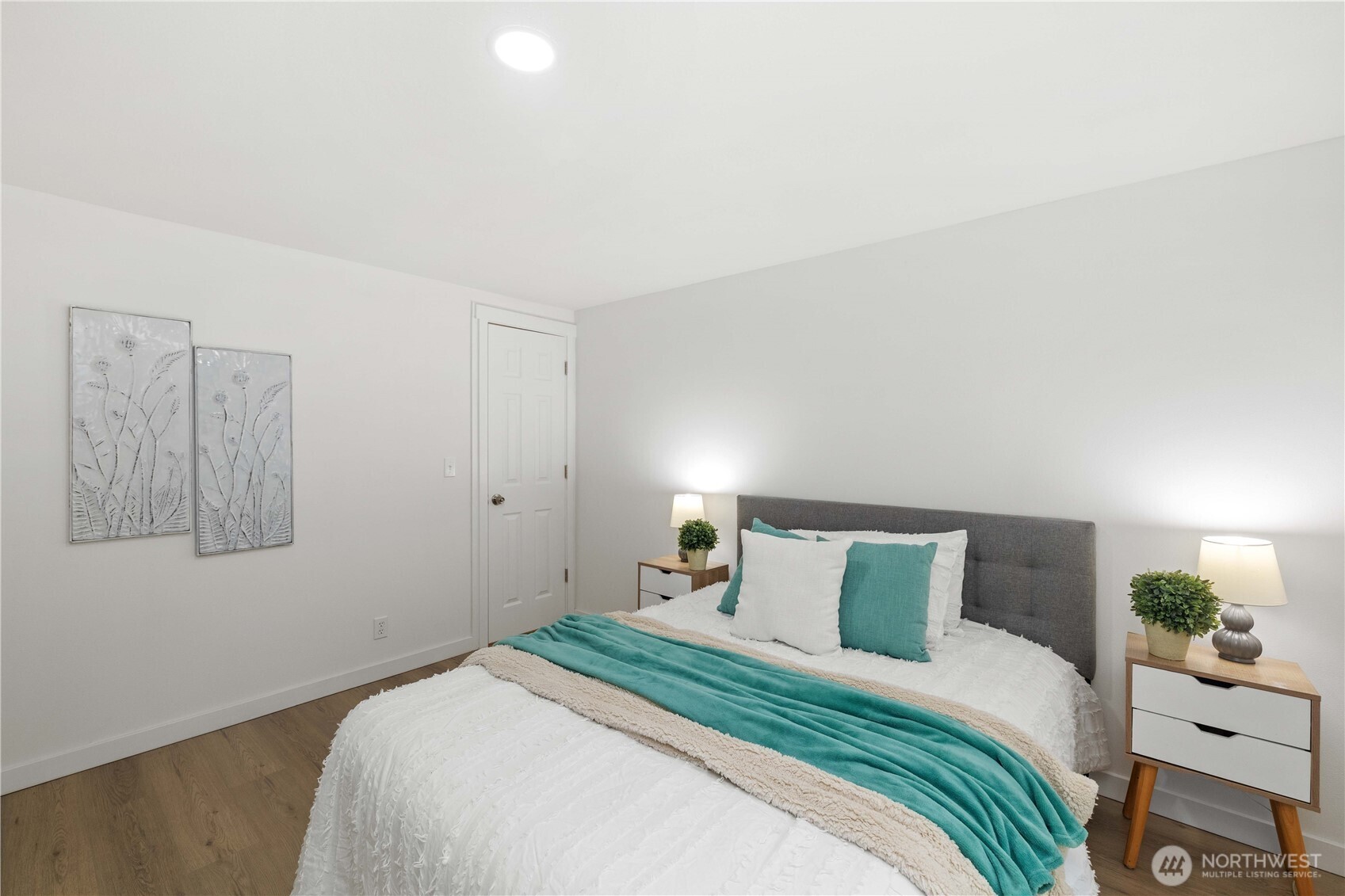 27428 Witte Road Southeast Maple Valley, WA 98038 - Photo 14 of 31 a bedroom with a bed and a painting on the wall