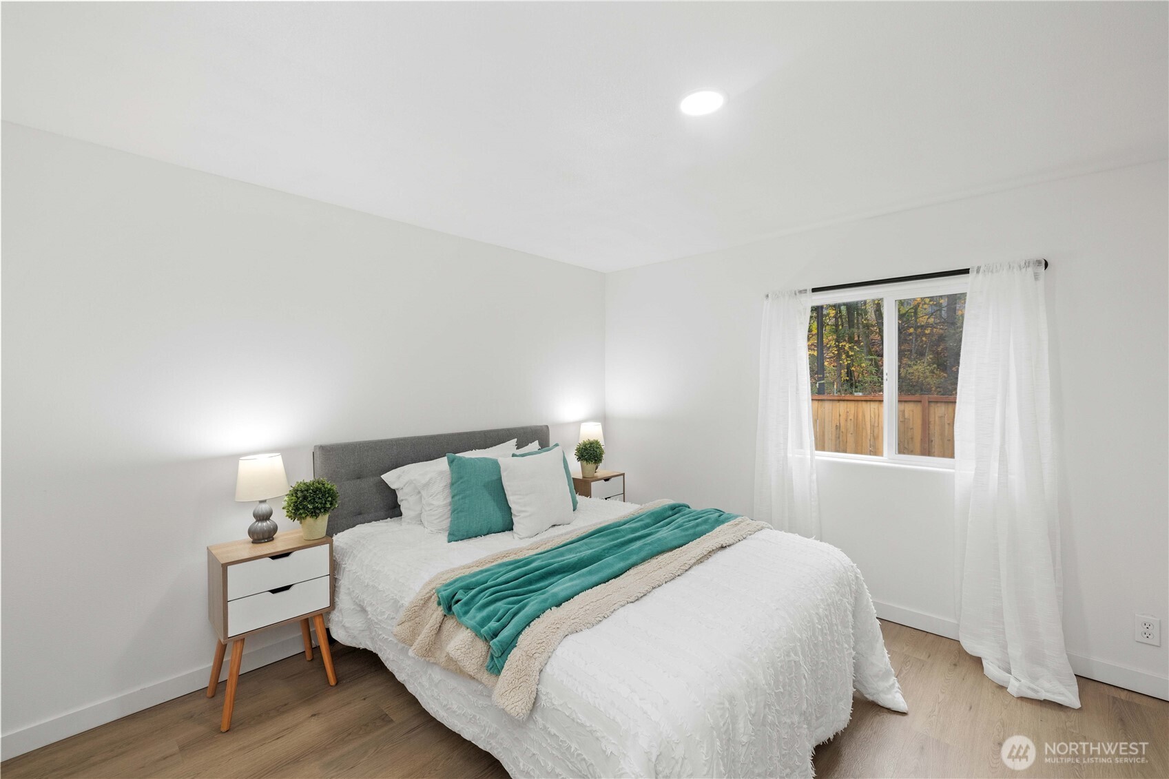 27428 Witte Road Southeast Maple Valley, WA 98038 - Photo 16 of 31 a bedroom with a bed and wooden floor