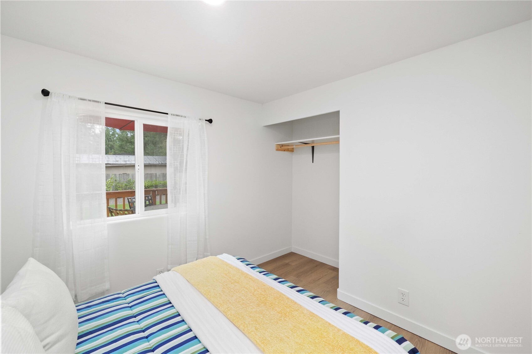 27428 Witte Road Southeast Maple Valley, WA 98038 - Photo 18 of 31 a bedroom with a bed and a window