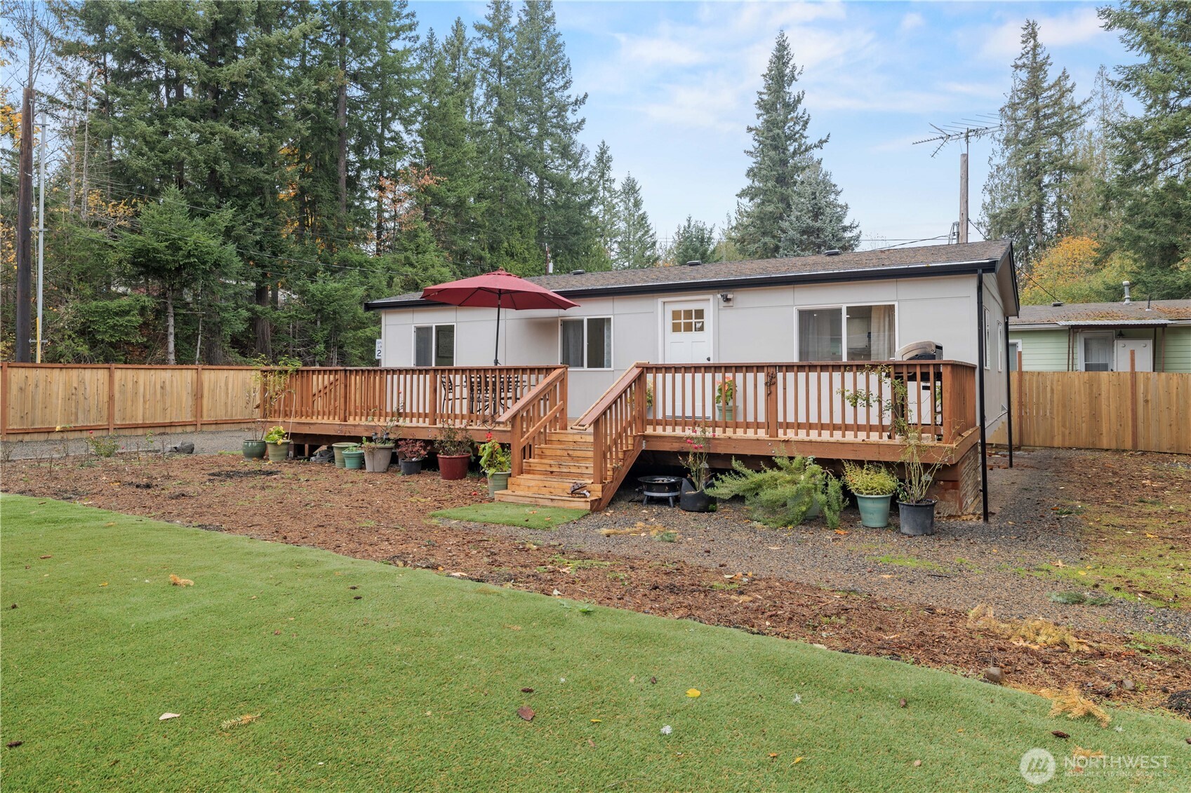 27428 Witte Road Southeast Maple Valley, WA 98038 - Photo 26 of 31 a view of a house with a yard and wooden fence