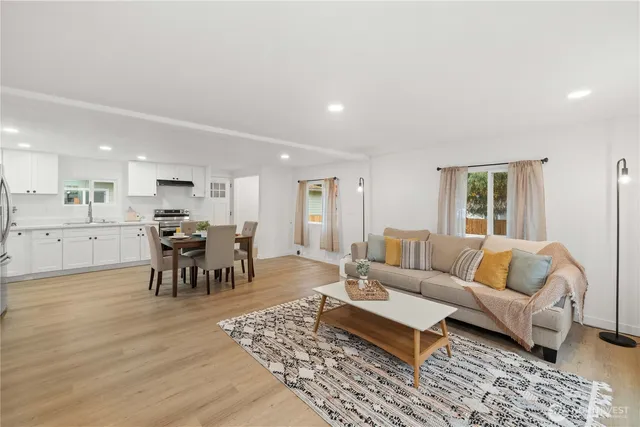 a living room with furniture and a table