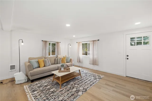 a living room with furniture and a rug