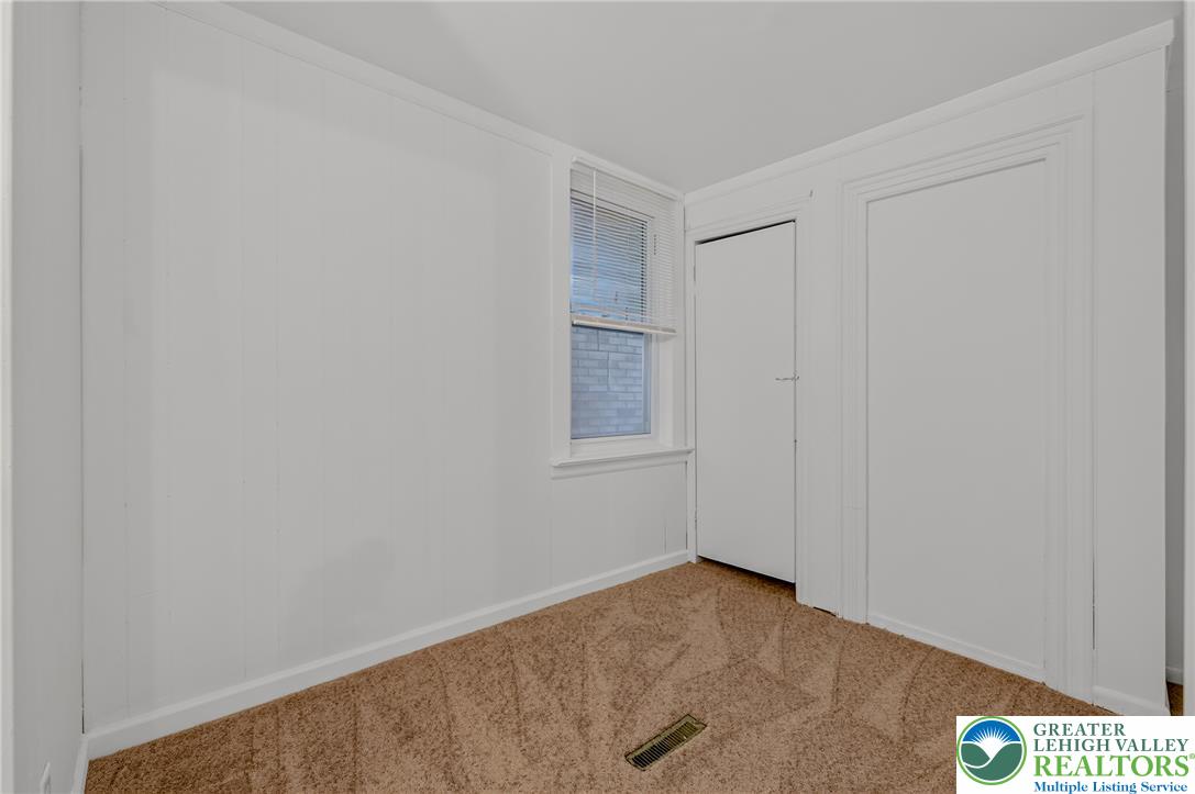 313 Main Street Slatington, PA 18080 - Photo 19 of 73 Well-lit and compact, this room offers ample natural light and plush carpeting.