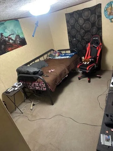 a bedroom with a bed and cabinets