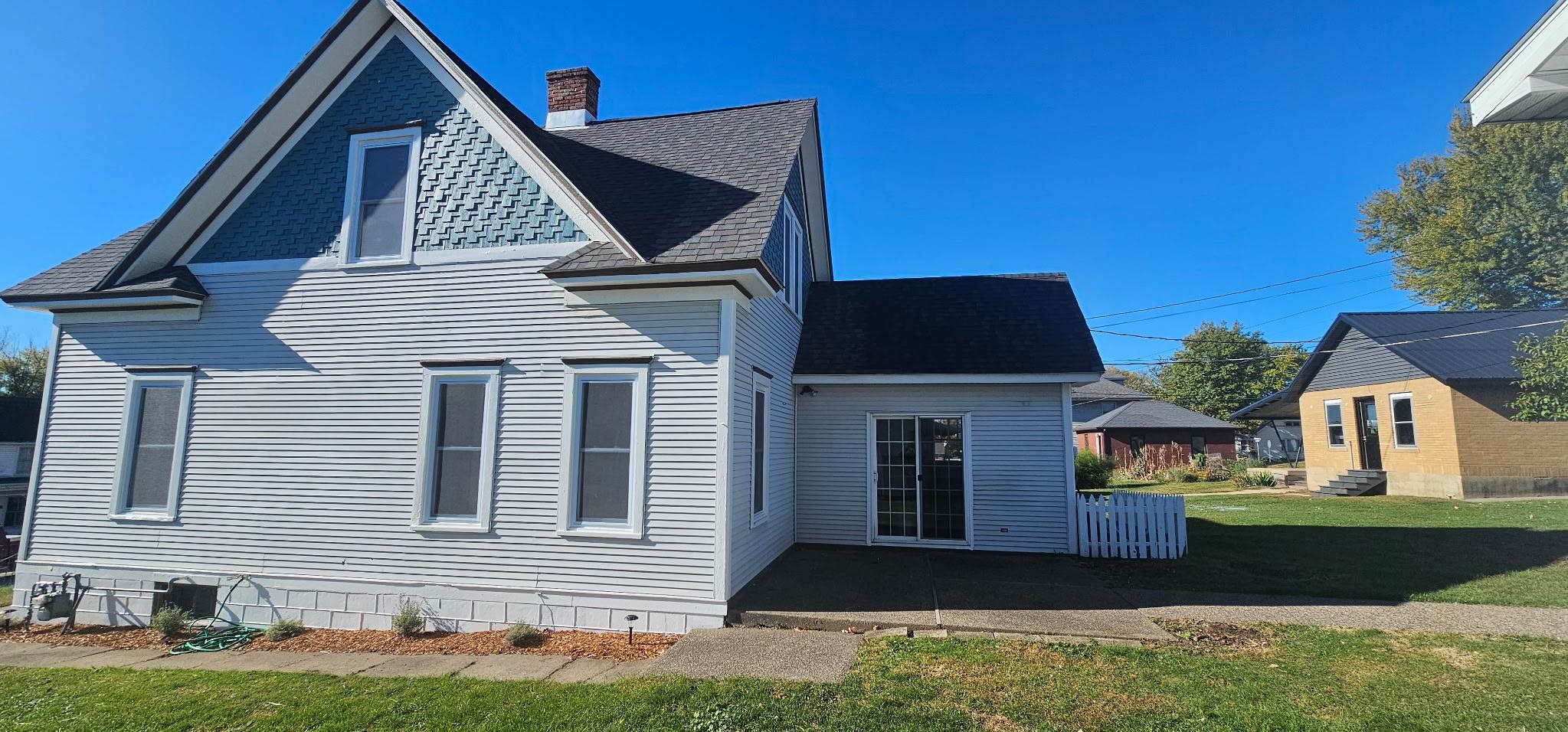 110 West Catlin Street Elizabeth, IL 61028 - Photo 18 of 31 a front view of a house with a yard