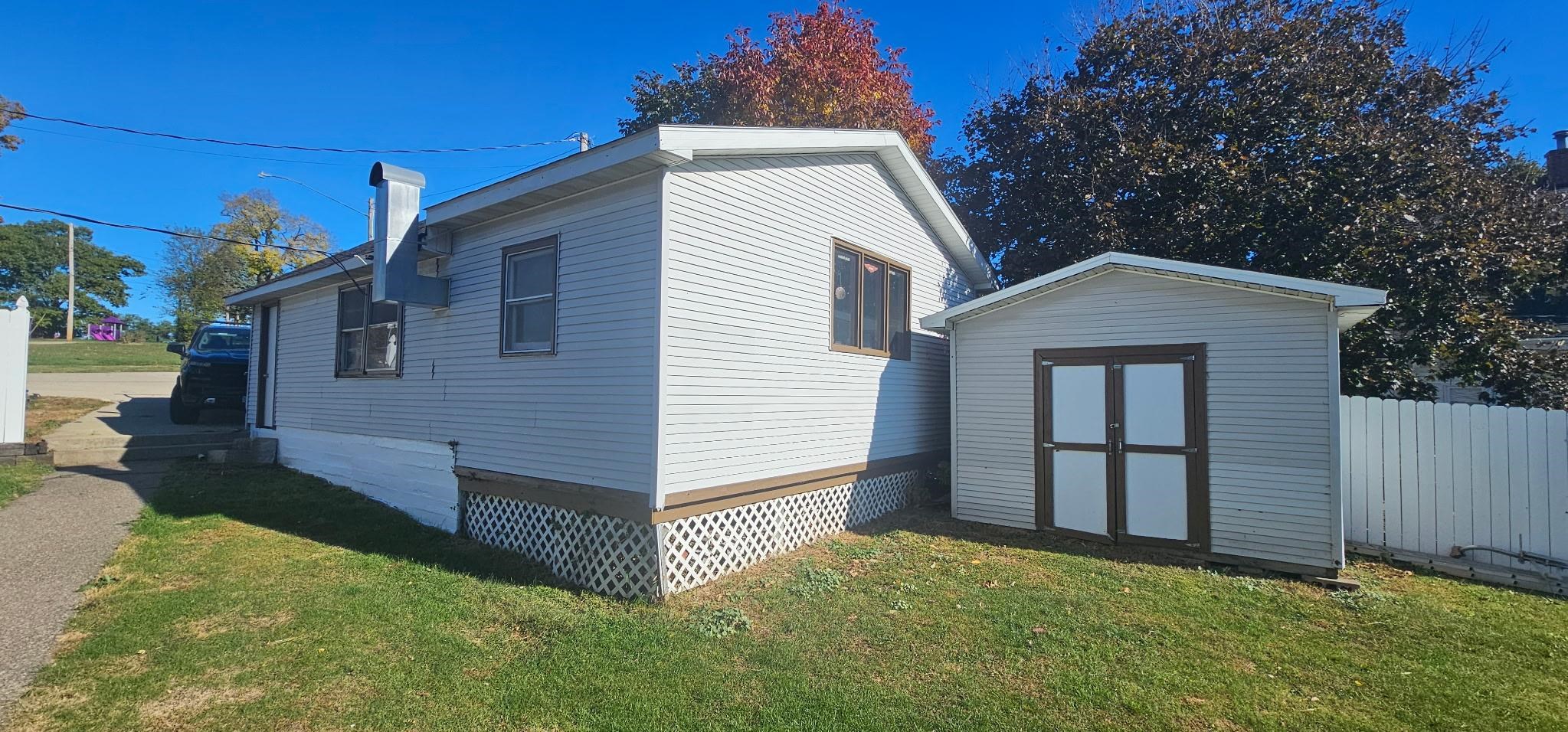 110 West Catlin Street Elizabeth, IL 61028 - Photo 19 of 31 a view of a house with a yard