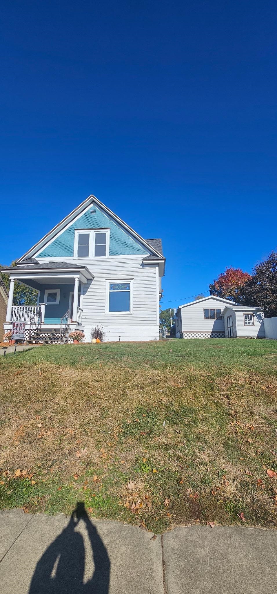 110 West Catlin Street Elizabeth, IL 61028 - Photo 21 of 31 a front view of a house with a yard