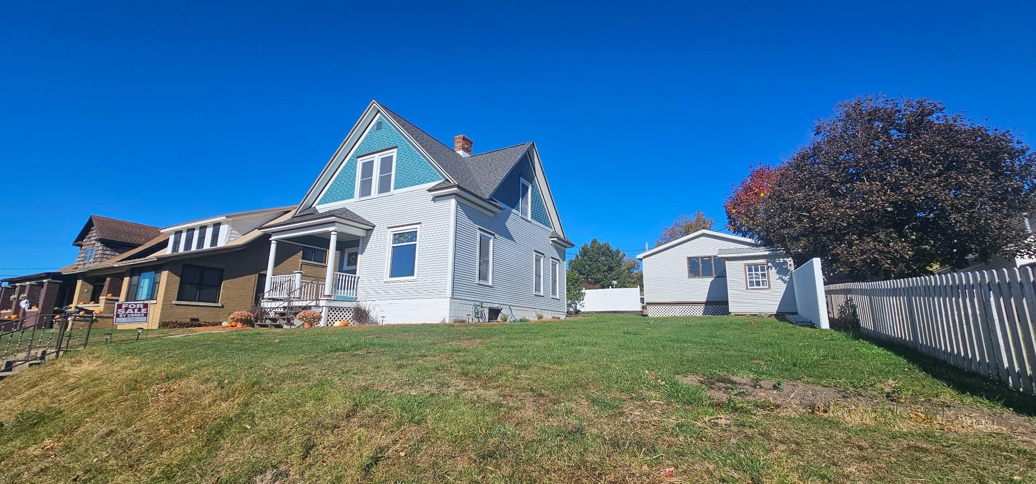 110 West Catlin Street Elizabeth, IL 61028 - Photo 23 of 31 a front view of a house with a yard