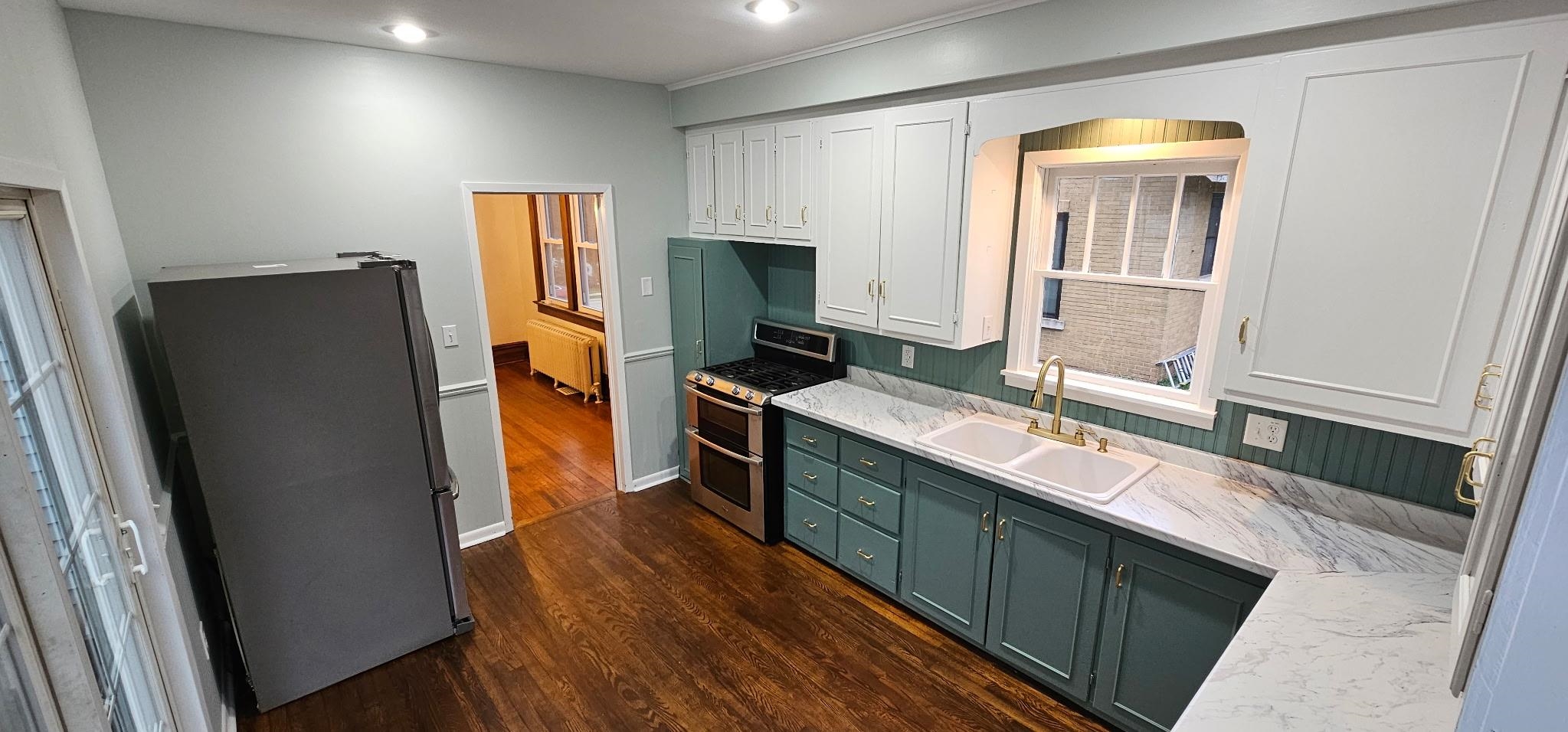 110 West Catlin Street Elizabeth, IL 61028 - Photo 4 of 31 a kitchen with granite countertop a refrigerator and a sink