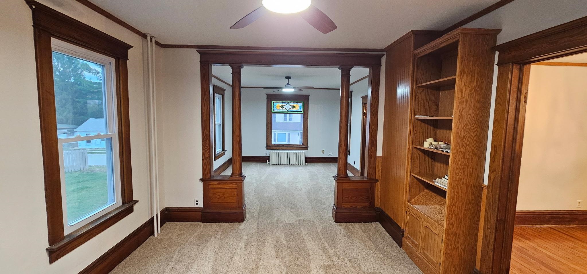 110 West Catlin Street Elizabeth, IL 61028 - Photo 5 of 31 a view of a hallway with wooden floor and staircase