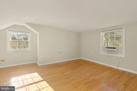 a view of a big room with windows and closet
