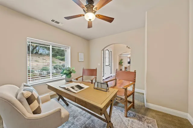 a view of a dining room with furniture window and outside view