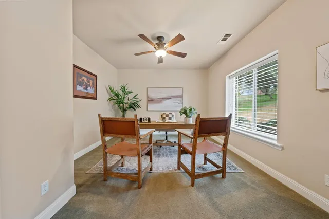 a living room with furniture a table and a flat screen tv