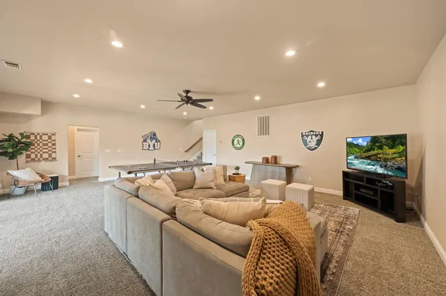 a bathroom with a granite countertop sink a mirror and a shower