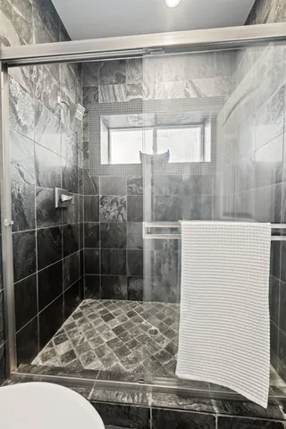 a balcony with table and chairs