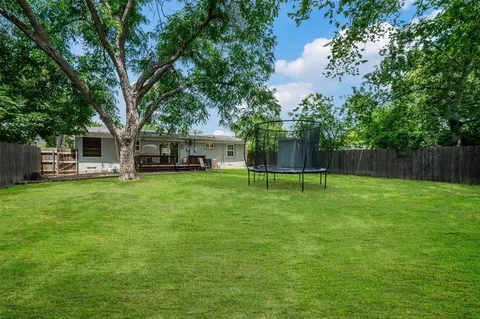 a view of a house with a big yard