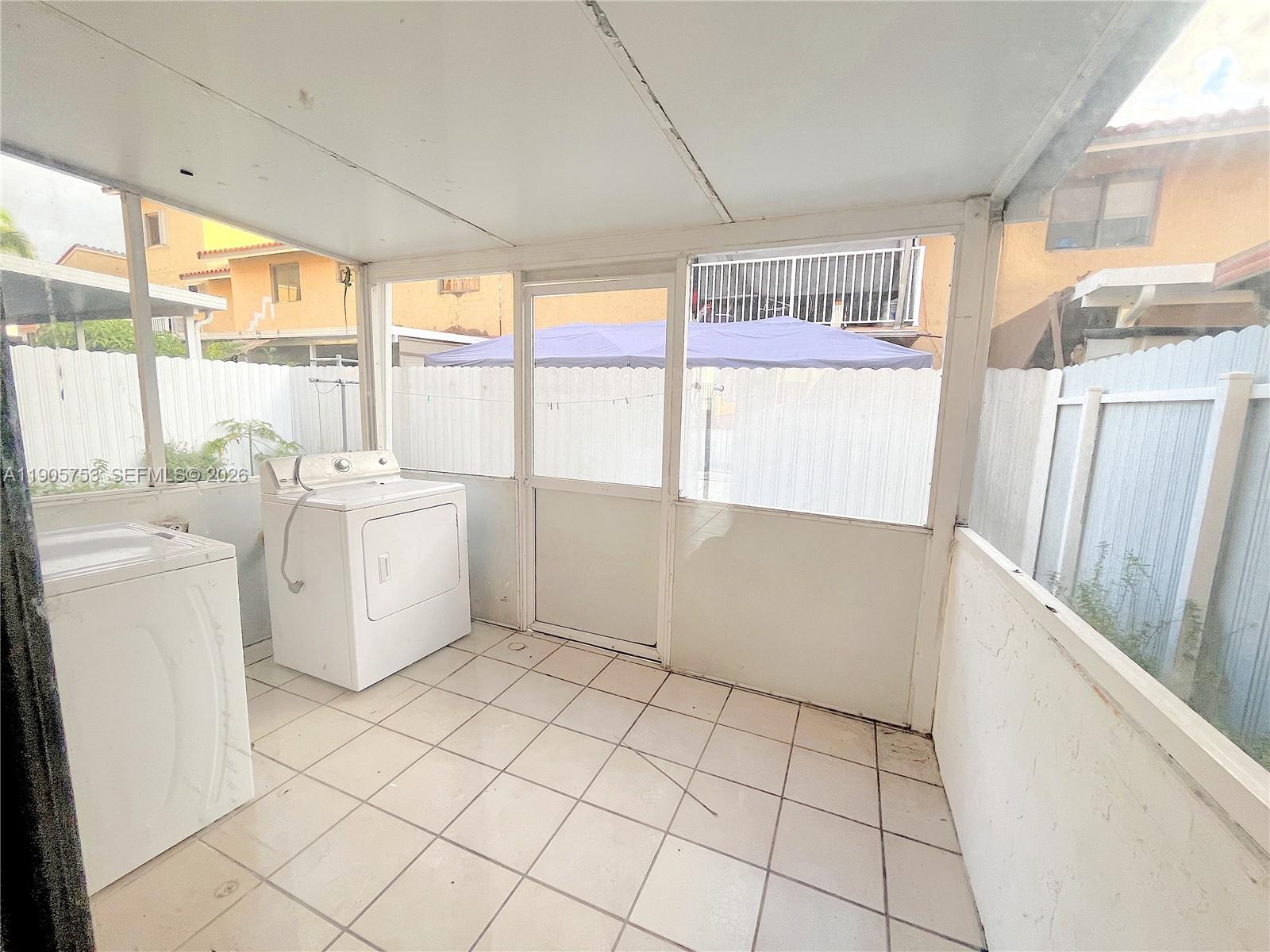 2740 West 63rd Street, Unit 104 Hialeah, FL 33016 - Photo 13 of 29 a view of utility room with washer and dryer