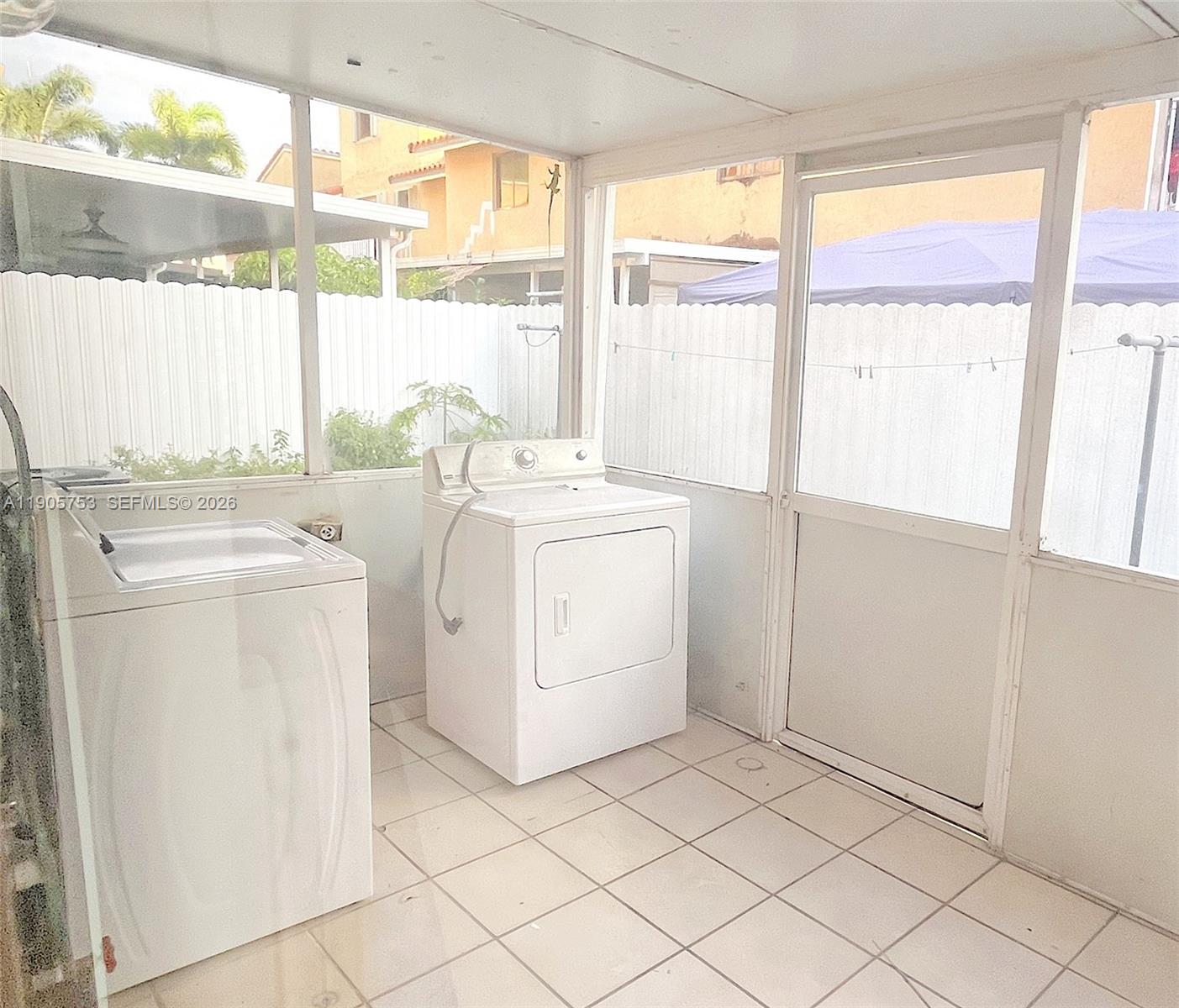 2740 West 63rd Street, Unit 104 Hialeah, FL 33016 - Photo 14 of 29 a utility room with dryer and washer