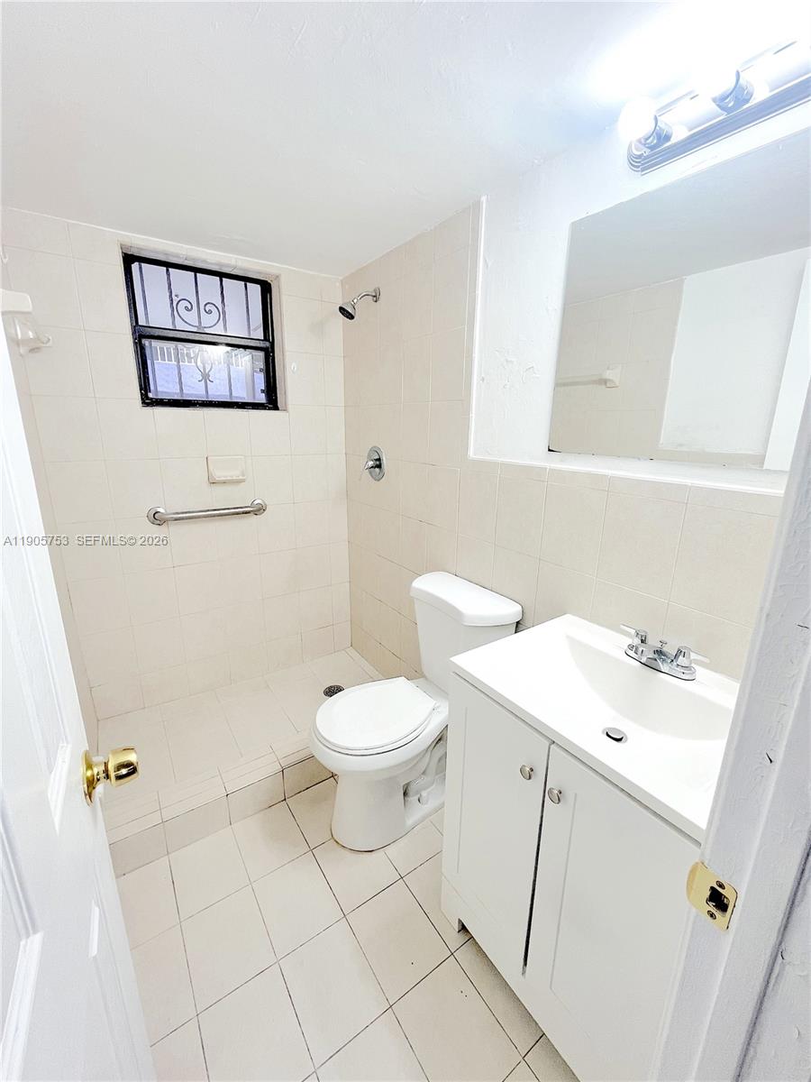 2740 West 63rd Street, Unit 104 Hialeah, FL 33016 - Photo 16 of 29 a white toilet sitting next to a bathroom sink
