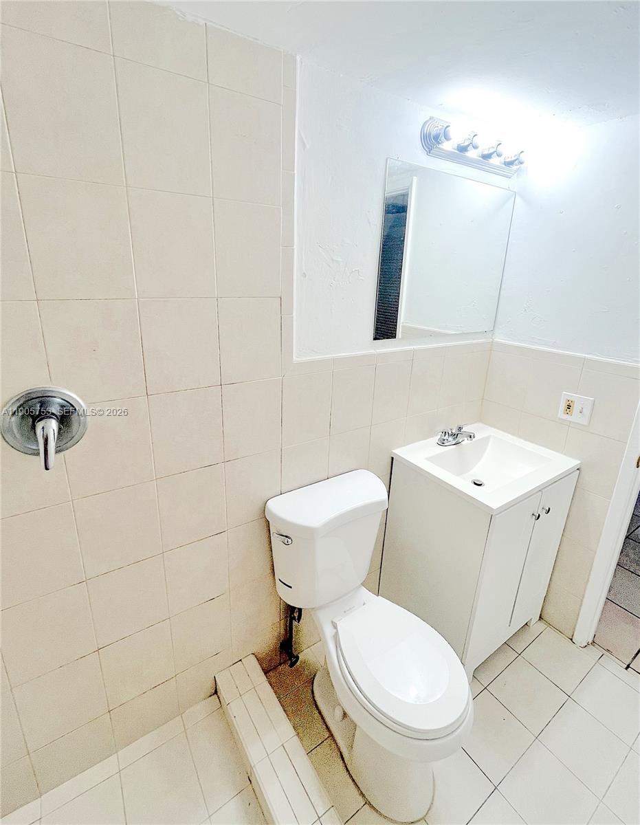 2740 West 63rd Street, Unit 104 Hialeah, FL 33016 - Photo 18 of 29 a white toilet sitting next to a bathroom sink