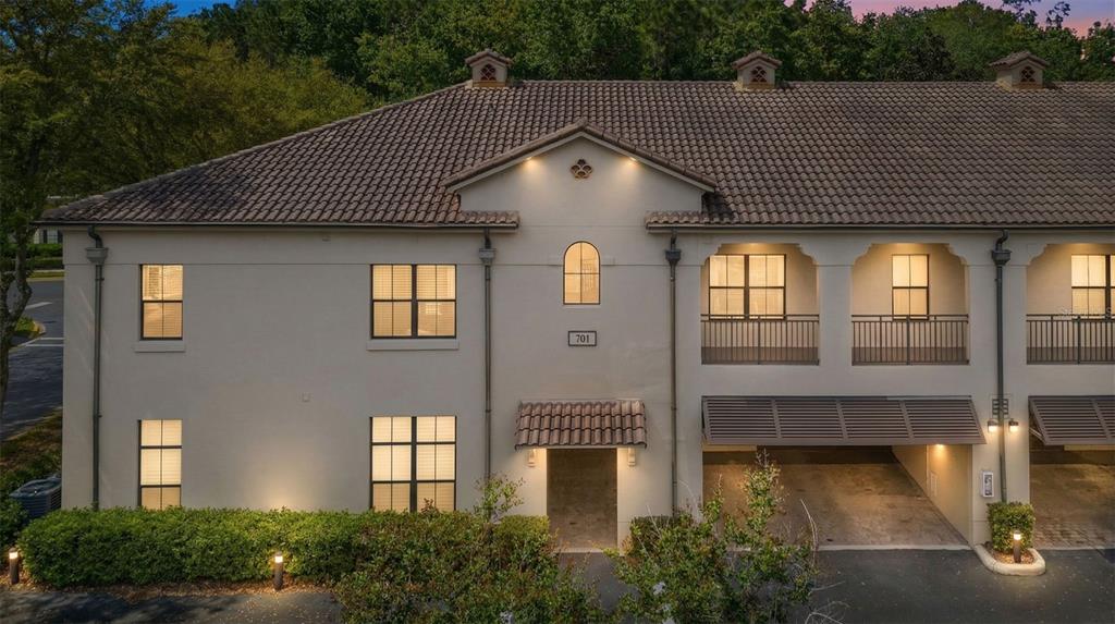 701 Westpark Way, Unit 101 Celebration, FL 34747 - Photo 1 of 69 a front view of a house with large windows