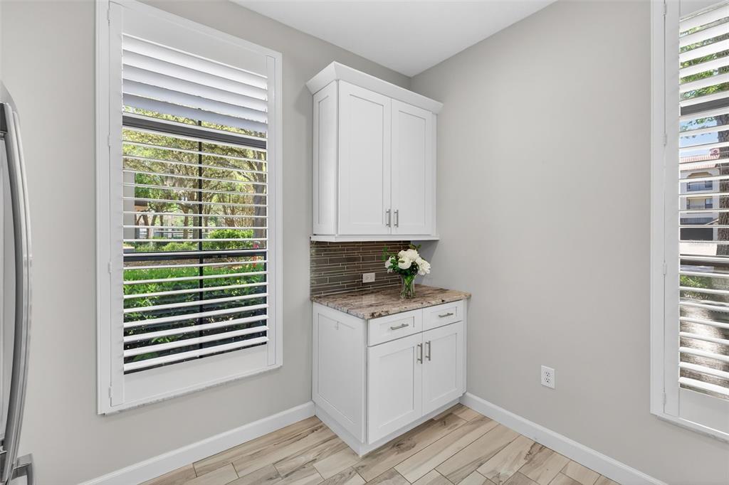 701 Westpark Way, Unit 101 Celebration, FL 34747 - Photo 11 of 69 a kitchen with a stove a sink and a window