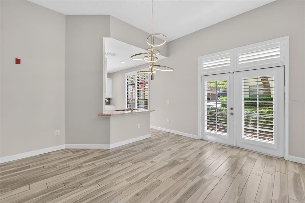 701 Westpark Way, Unit 101 Celebration, FL 34747 - Photo 14 of 69 wooden floor in an empty room with a window