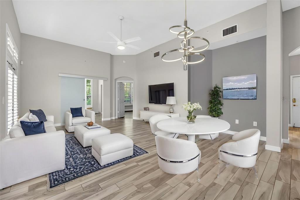 701 Westpark Way, Unit 101 Celebration, FL 34747 - Photo 2 of 69 a living room with furniture and a flat screen tv