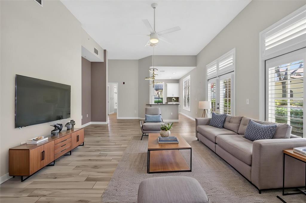 701 Westpark Way, Unit 101 Celebration, FL 34747 - Photo 21 of 69 a living room with furniture and a flat screen tv