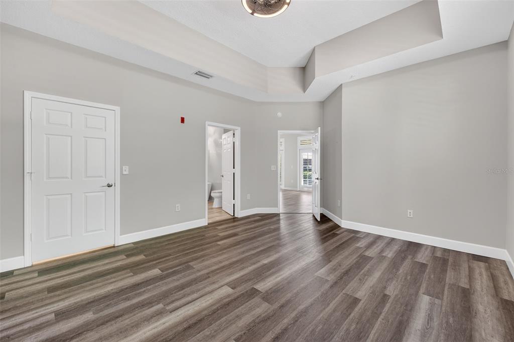 701 Westpark Way, Unit 101 Celebration, FL 34747 - Photo 28 of 69 a view of an empty room and wooden floor